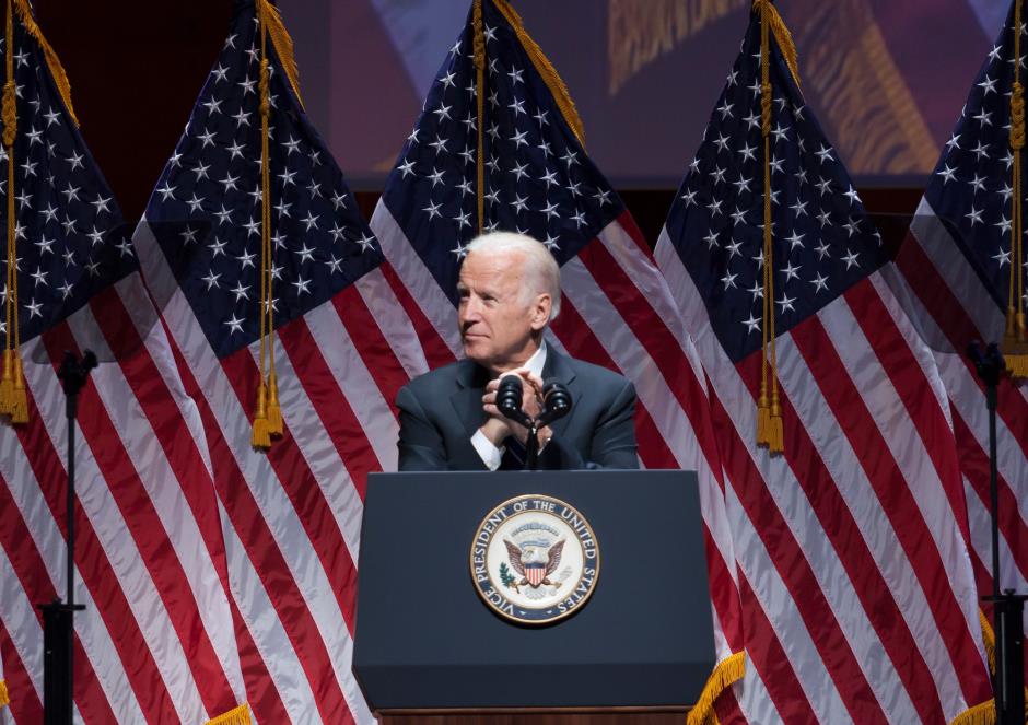 A picture of joe biden on the presidential stage